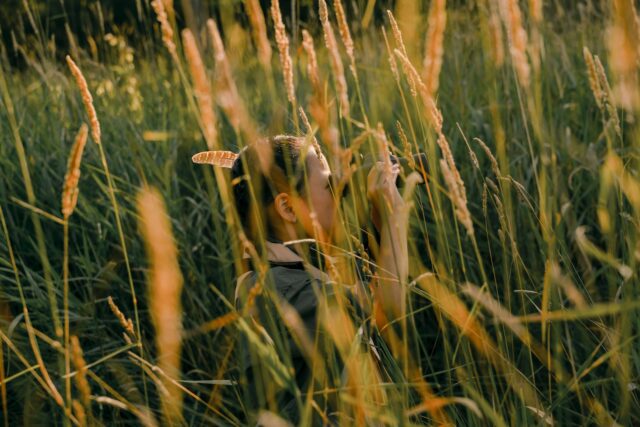 A Girl Using Binoculars in a Scavenger Hunt